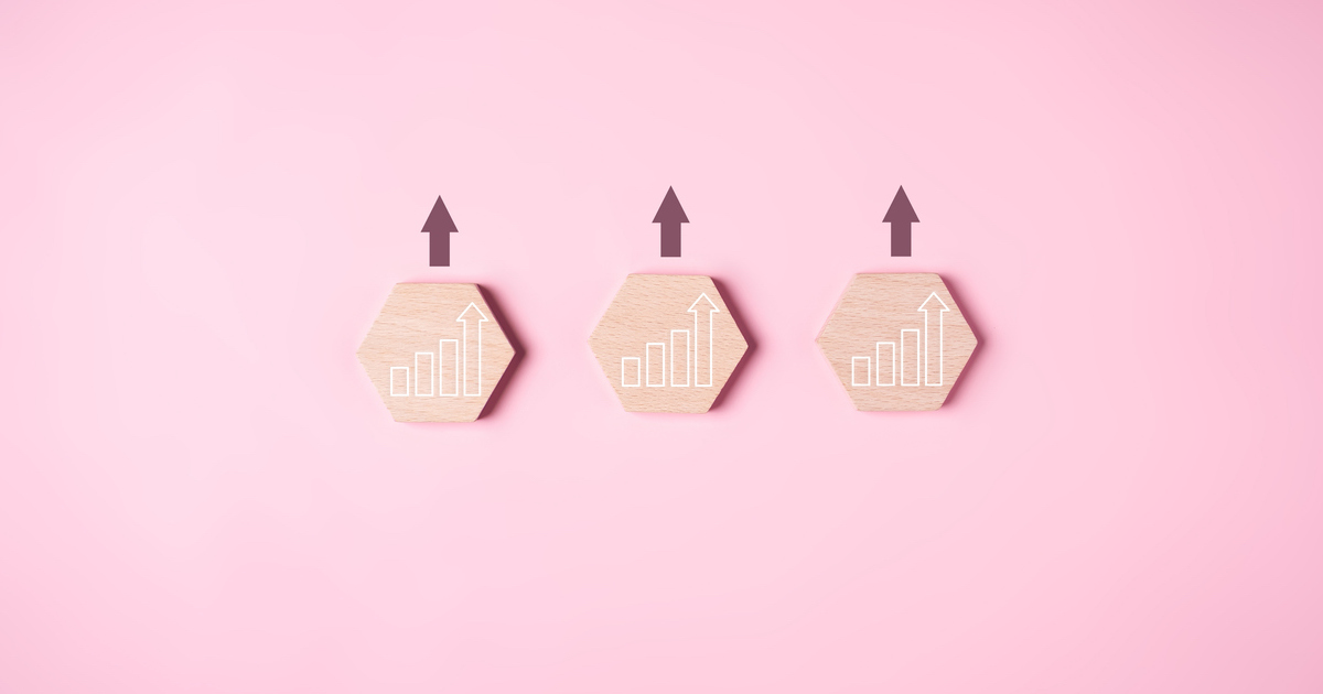 Wooden blocks with upward trend arrows