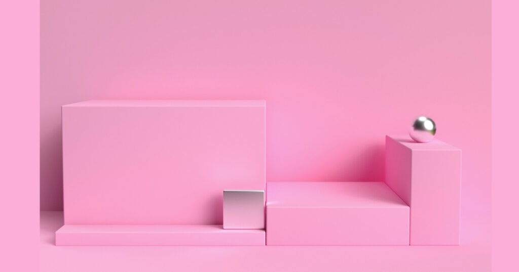 Geometric pink shapes and metallic sphere arrangement