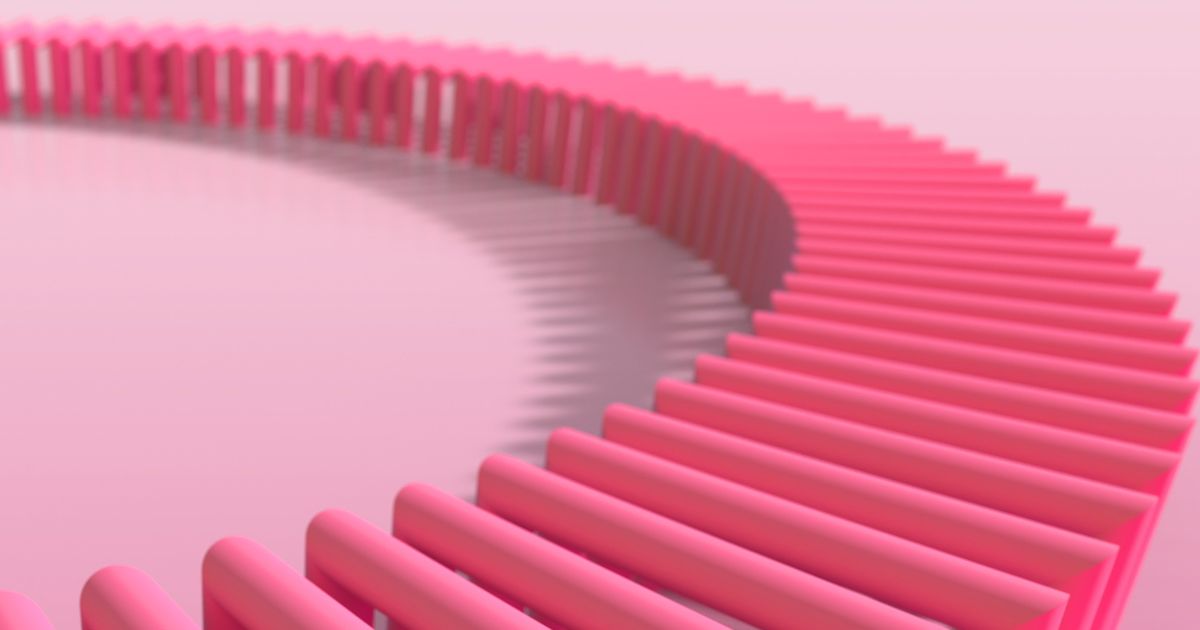 Pink dominoes arranged in a circular pattern