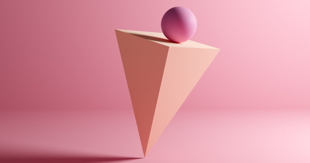 Pink sphere atop inverted pyramid, pink background.