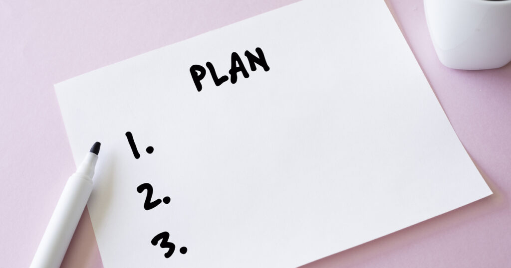 Blank plan list with marker on pink background.
