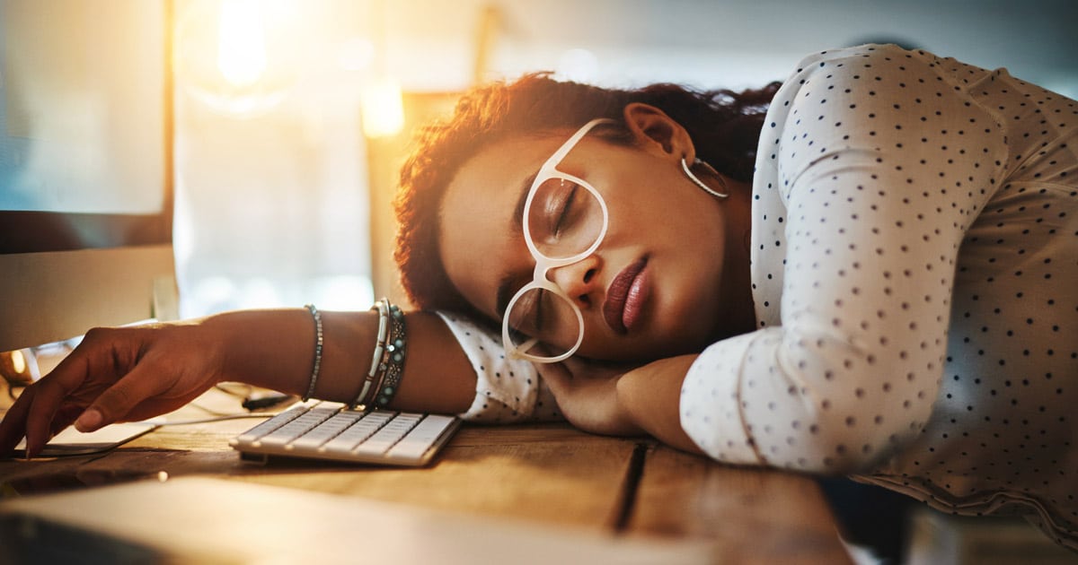 burned out business woman asleep at desk