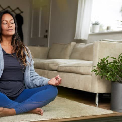 woman meditating while sitting