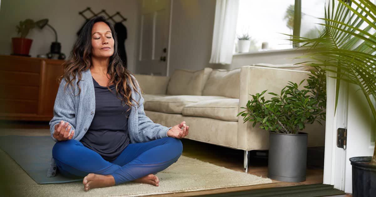 woman meditating while sitting