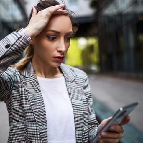 stressed businesswoman after taking a business call