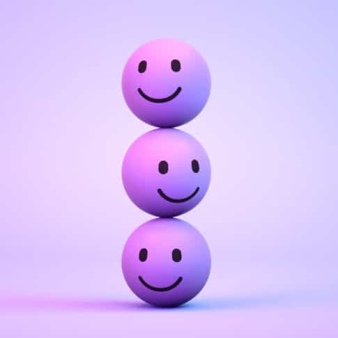 3d rendering of Emoji with smiley face on purple background