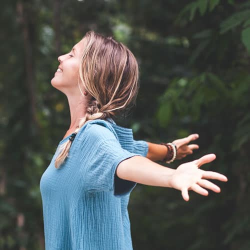 woman connecting with nature while releasing limiting beliefs, thumbnail