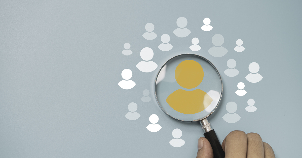 Magnifying glass highlighting orange user icon