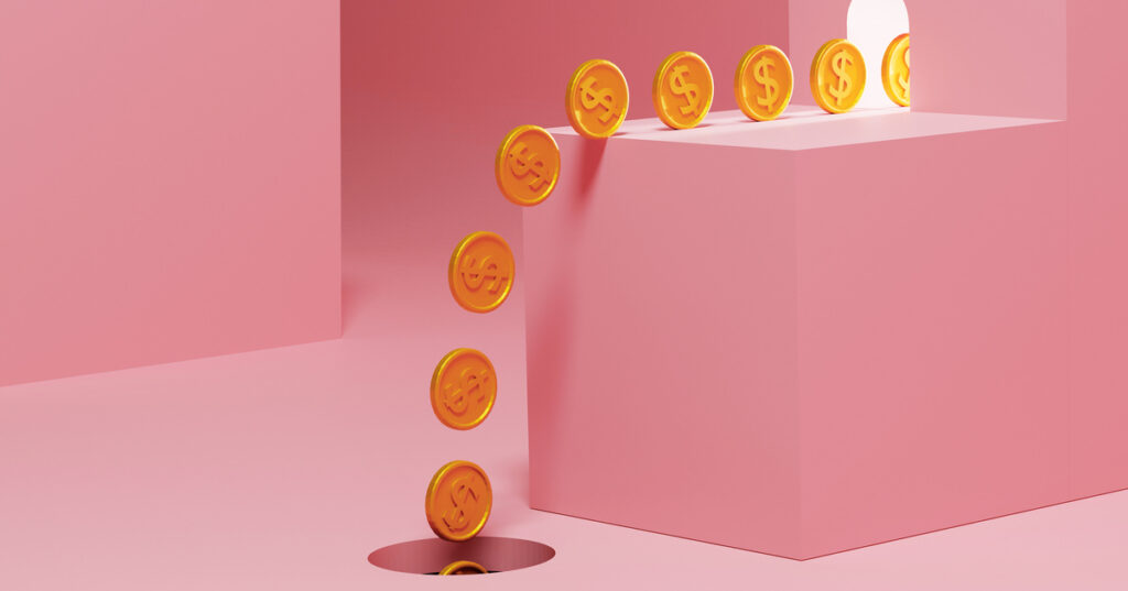 Coins falling into hole on pink background.