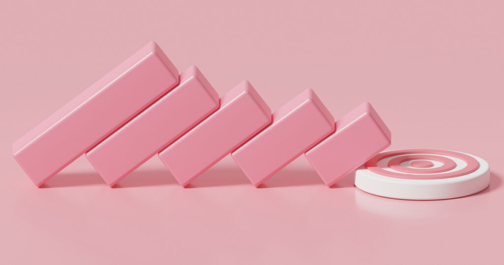 Pink blocks falling towards a target on pink background.