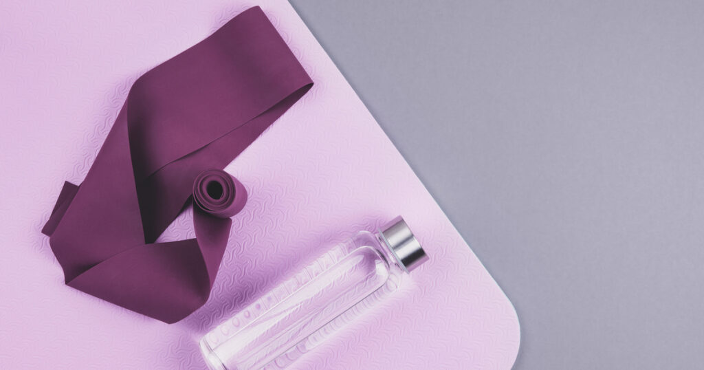 Yoga mat, resistance band, and water bottle