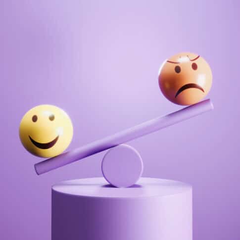 happy and angry emoji emoticon spheres on balance beam