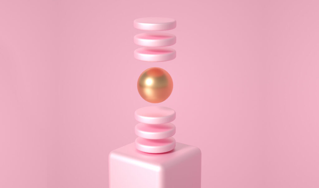 floating golden sphere between pink discs