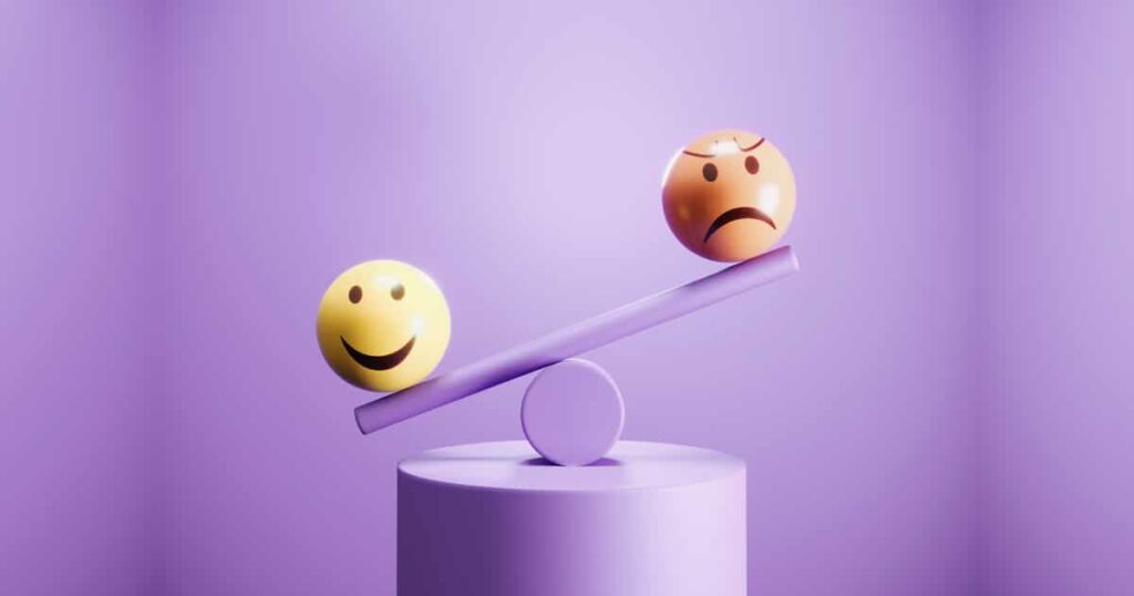happy and angry emoji emoticon spheres on balance beam