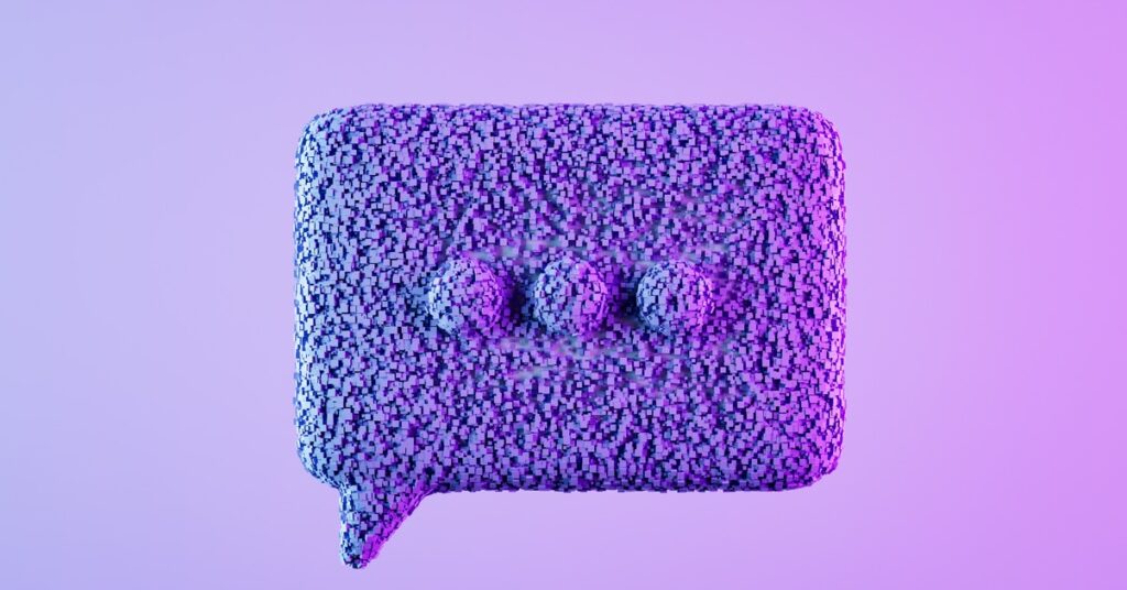 Speech bubble with particles on neon background. Digitally generated image.