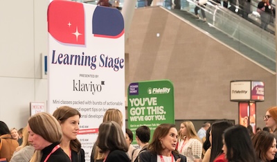 People attending a learning event at convention center.