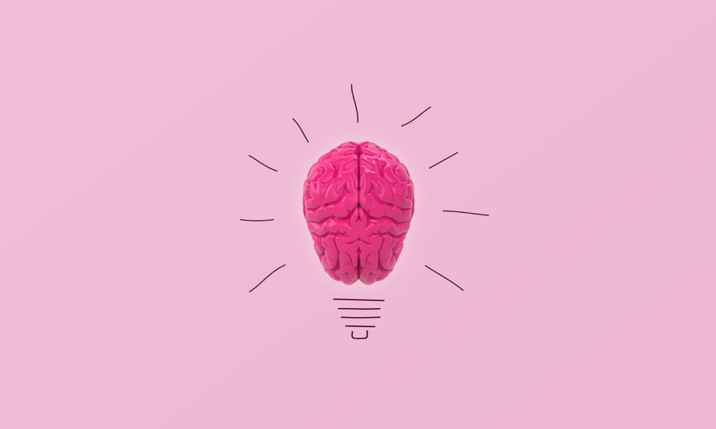 glowing pink brain as light bulb concept
