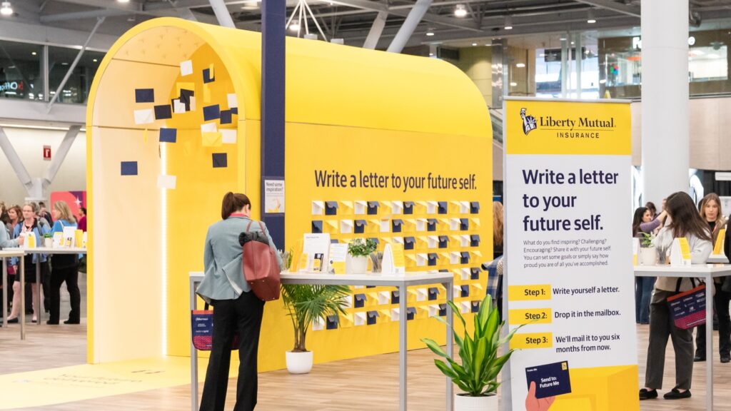 Visitors engage with 'Write a letter' exhibit.