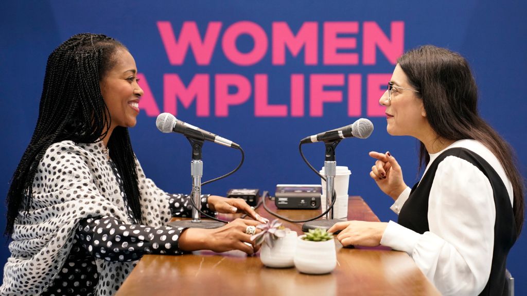 Two women podcasting at Women Amplified event