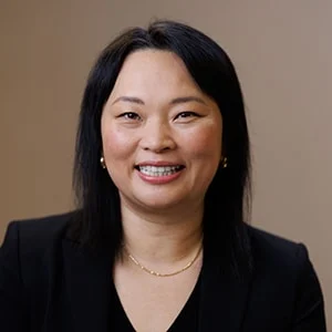 Smiling woman in black blazer portrait