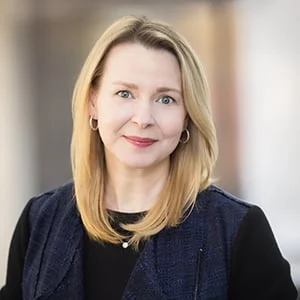 Professional woman smiling in business attire
