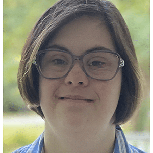 Smiling person wearing eyeglasses outdoors