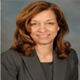 Professional woman smiling in business attire portrait