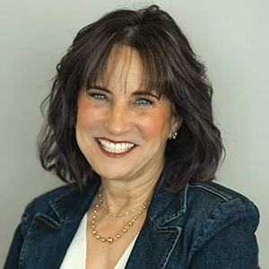 Smiling woman in denim jacket portrait