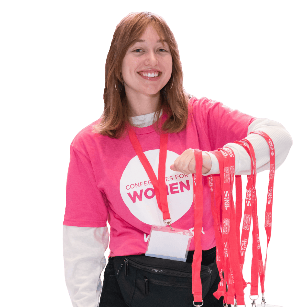 Smiling volunteer with lanyards, Conferences for Women shirt.