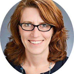 Smiling woman with glasses and brown hair