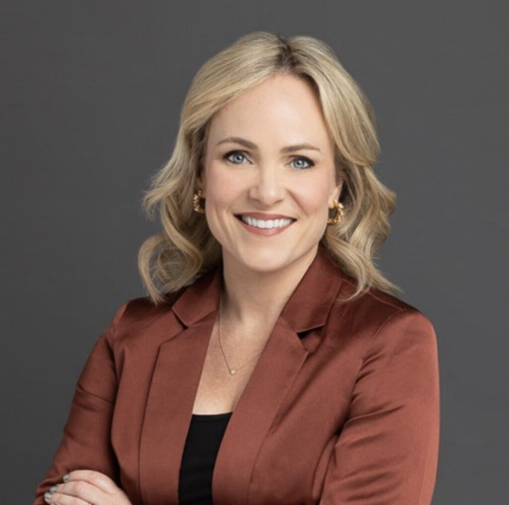 Smiling woman in brown blazer portrait