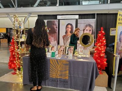 Carla Shaw jewelry booth at an indoor event