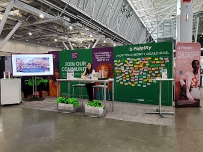 Fidelity booth at financial event with message board