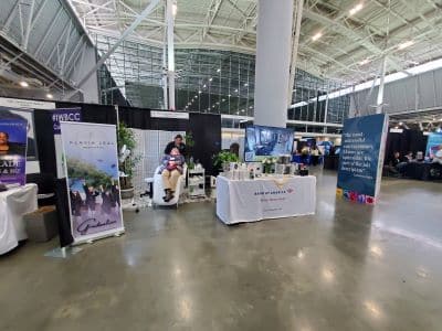 Exhibit booth at convention center with displays and banners