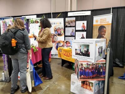 People visiting health education booth at community event