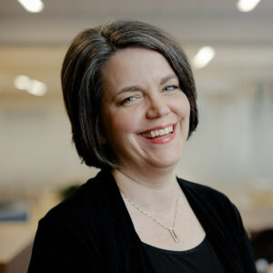 Smiling woman in a professional indoor setting