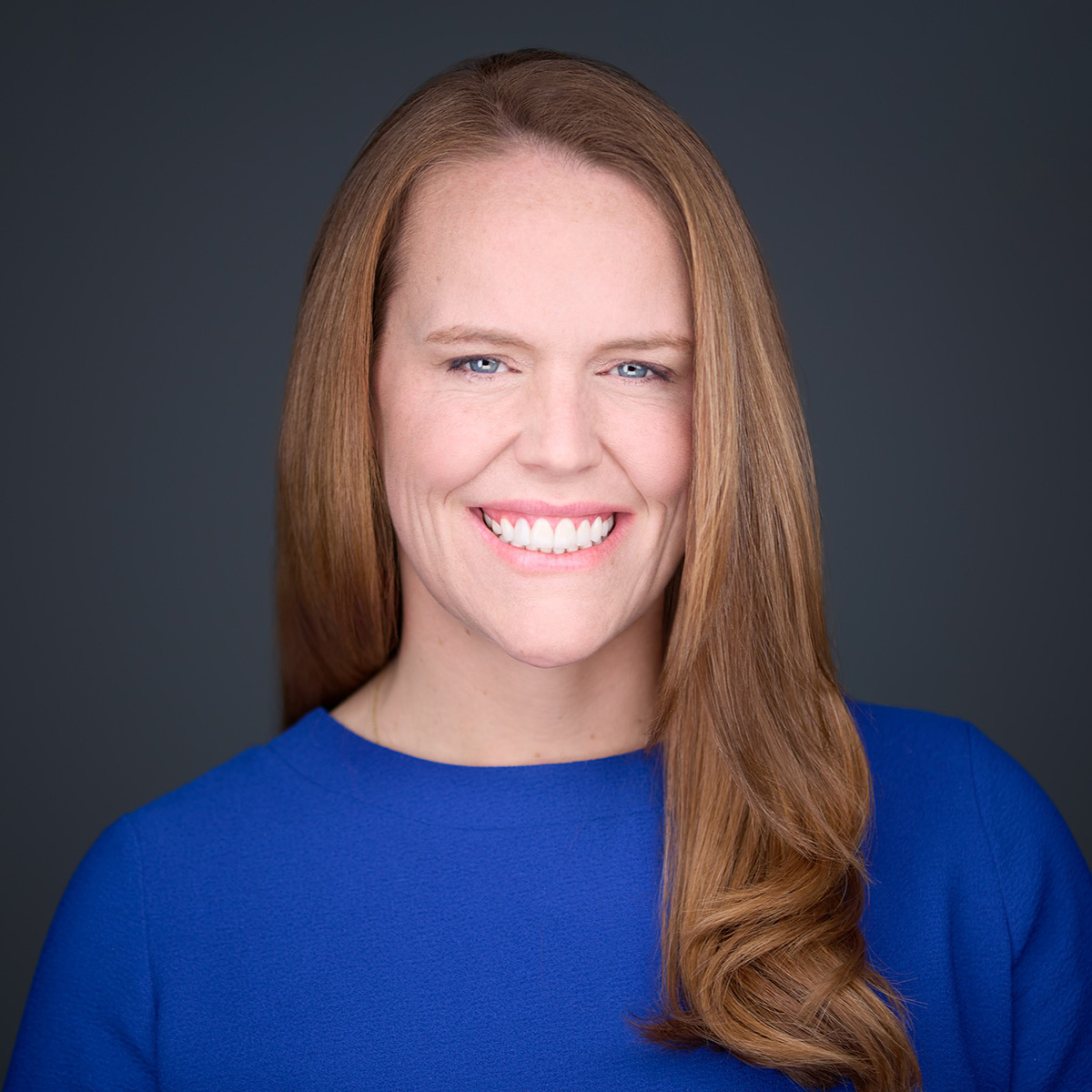 Smiling woman in blue top portrait
