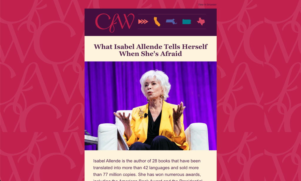 Author speaking on stage in yellow jacket