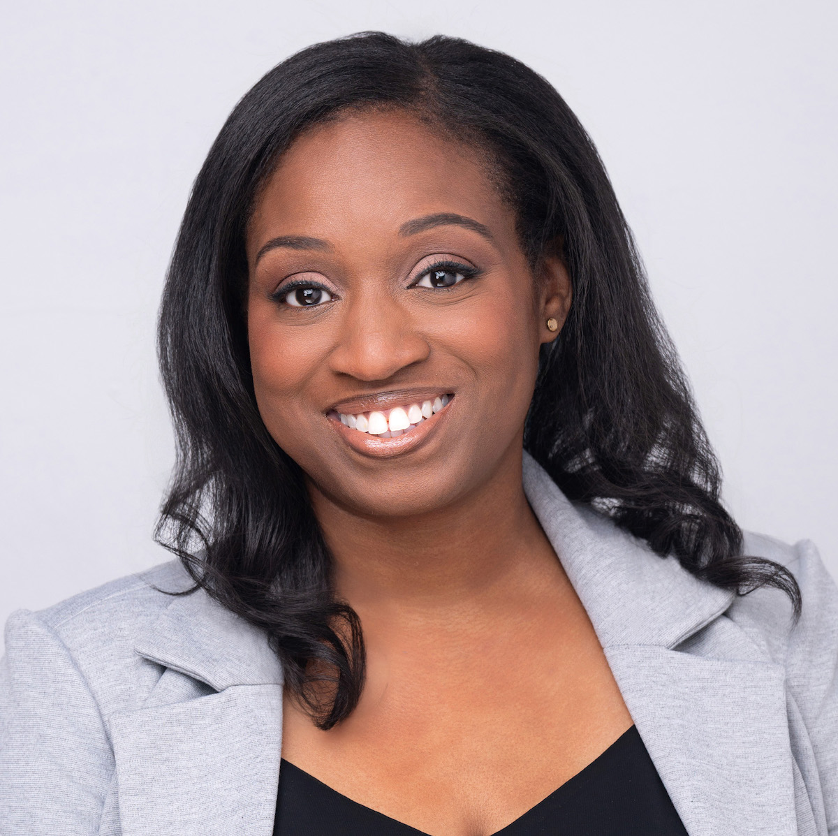 Smiling woman in gray blazer portrait