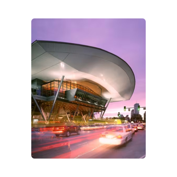 Modern city building with traffic at sunset