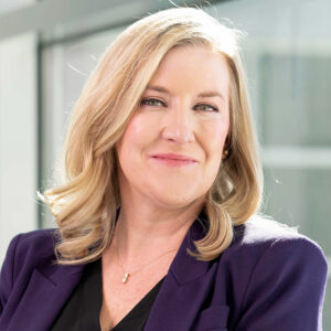 Smiling woman in professional attire indoors
