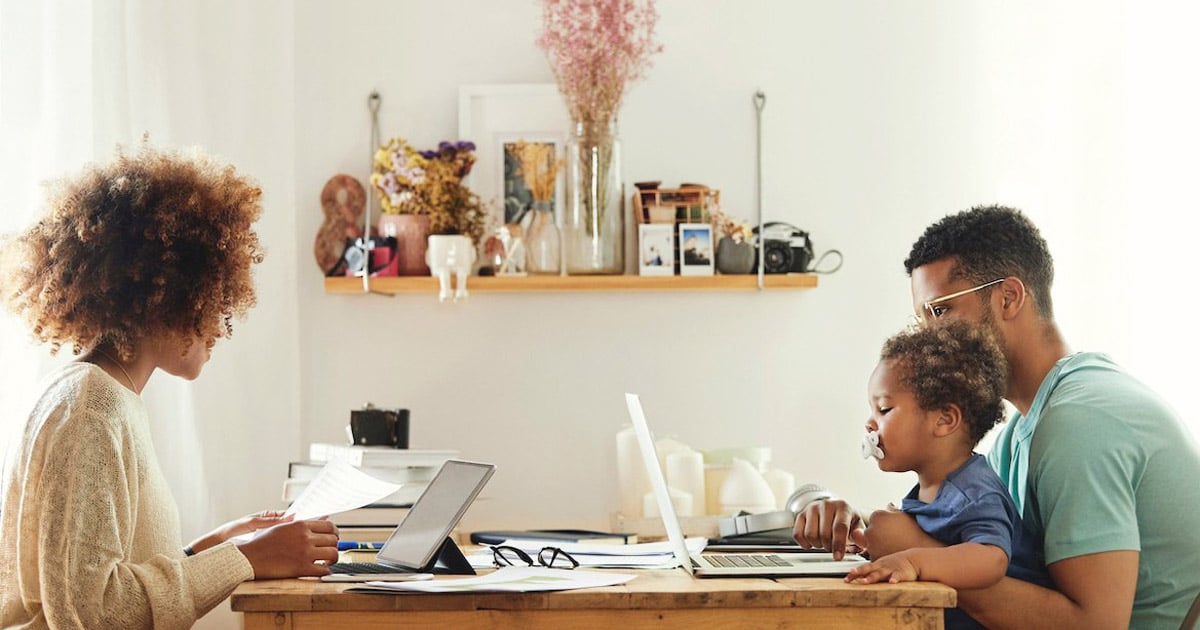mother and family working from home at kitchen table