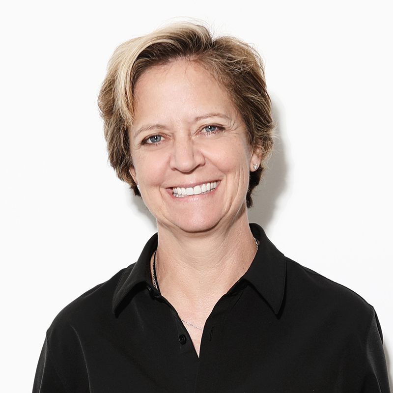 Smiling person wearing black shirt against white background