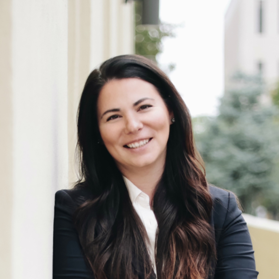 Smiling woman in business attire outdoors