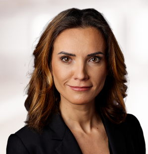 Professional woman smiling in business attire