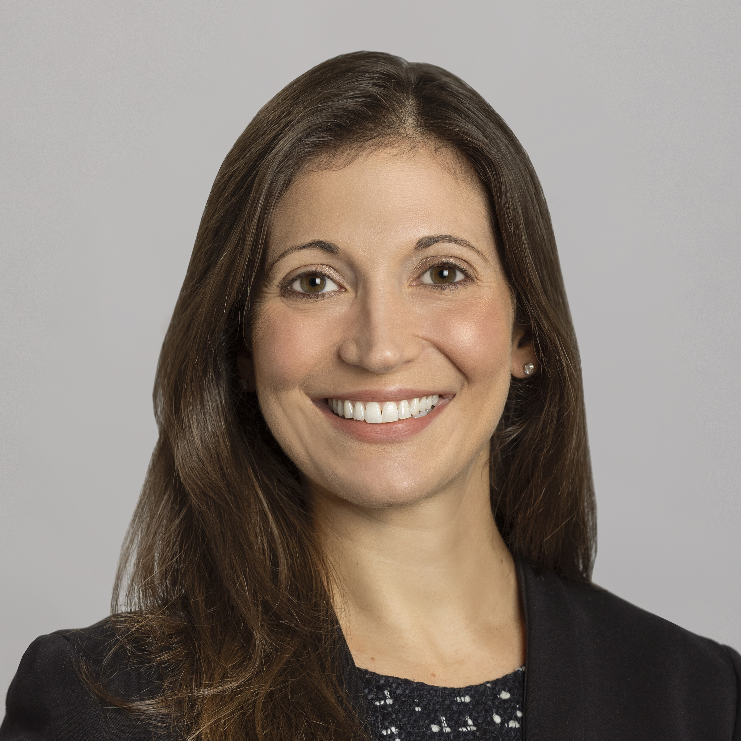 Smiling woman in professional attire headshot