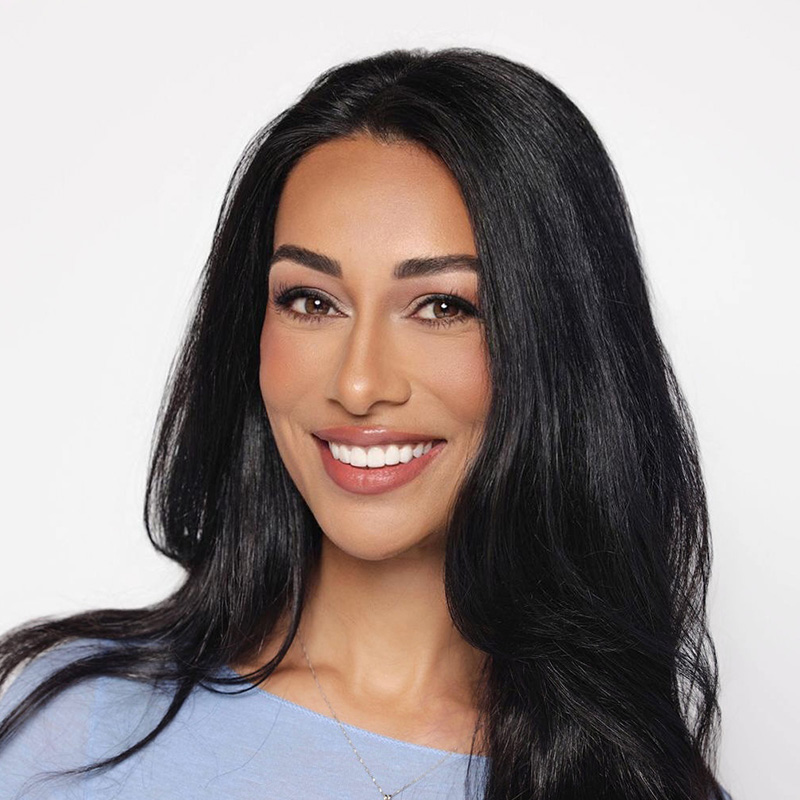 Smiling woman with long dark hair headshot
