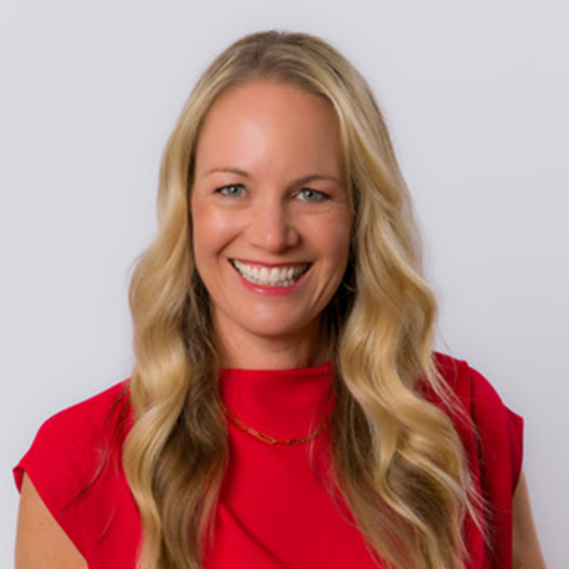 Smiling blonde woman in red top portrait