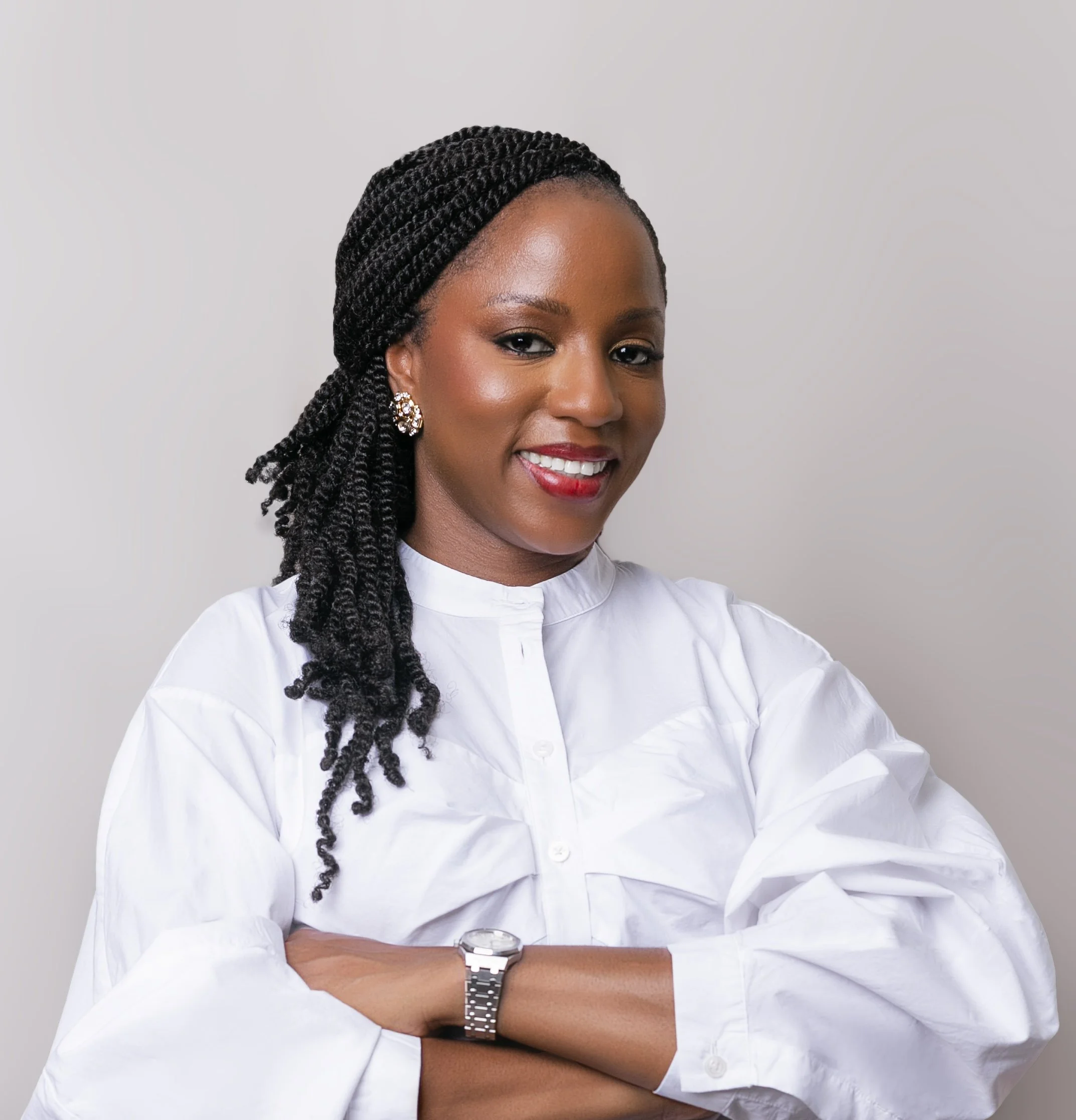 Smiling woman in white blouse with braided hair